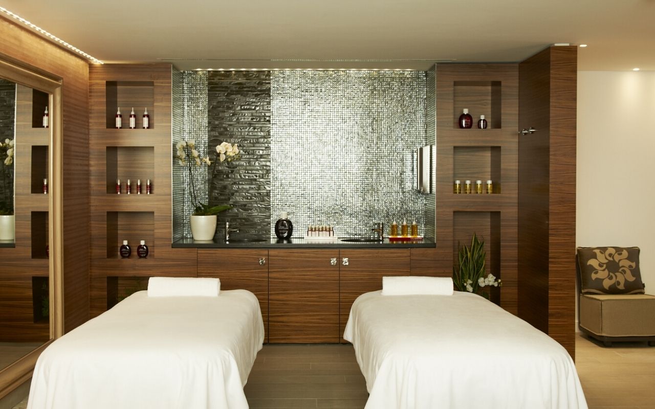 Massage room of the clarins spa of the InterContinental Marseille - Hôtel Dieu, warm and mineral decoration realized by the studio jean-philippe nuel