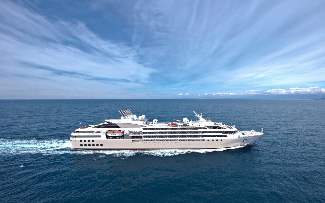 One of Compagnie du Ponant's sister ships at sea, a luxury cruise ship designed by the interior design studio jean-philippe nuel