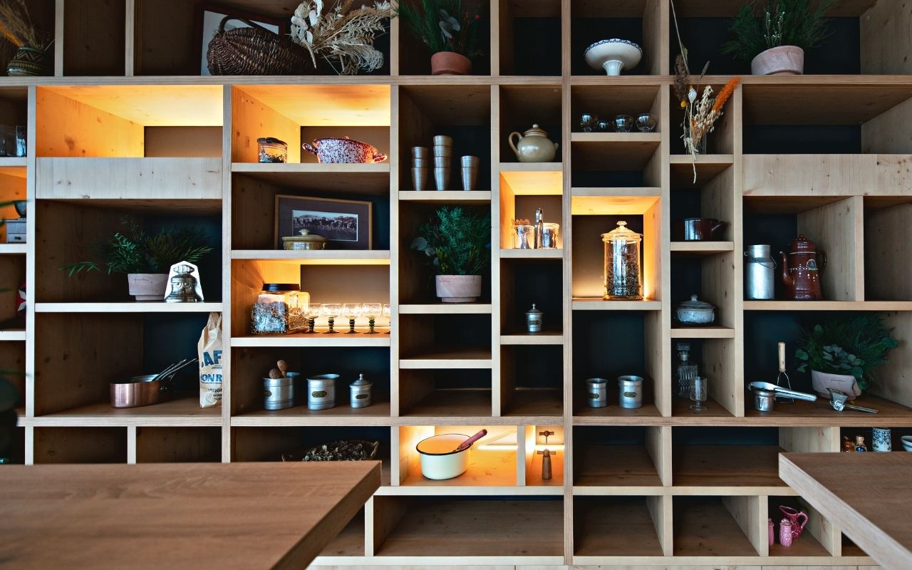 Small lounge of the Danone headquarters in the Convergence building designed by the interior design studio jean-philippe nuel with illuminated shelves and play of forms