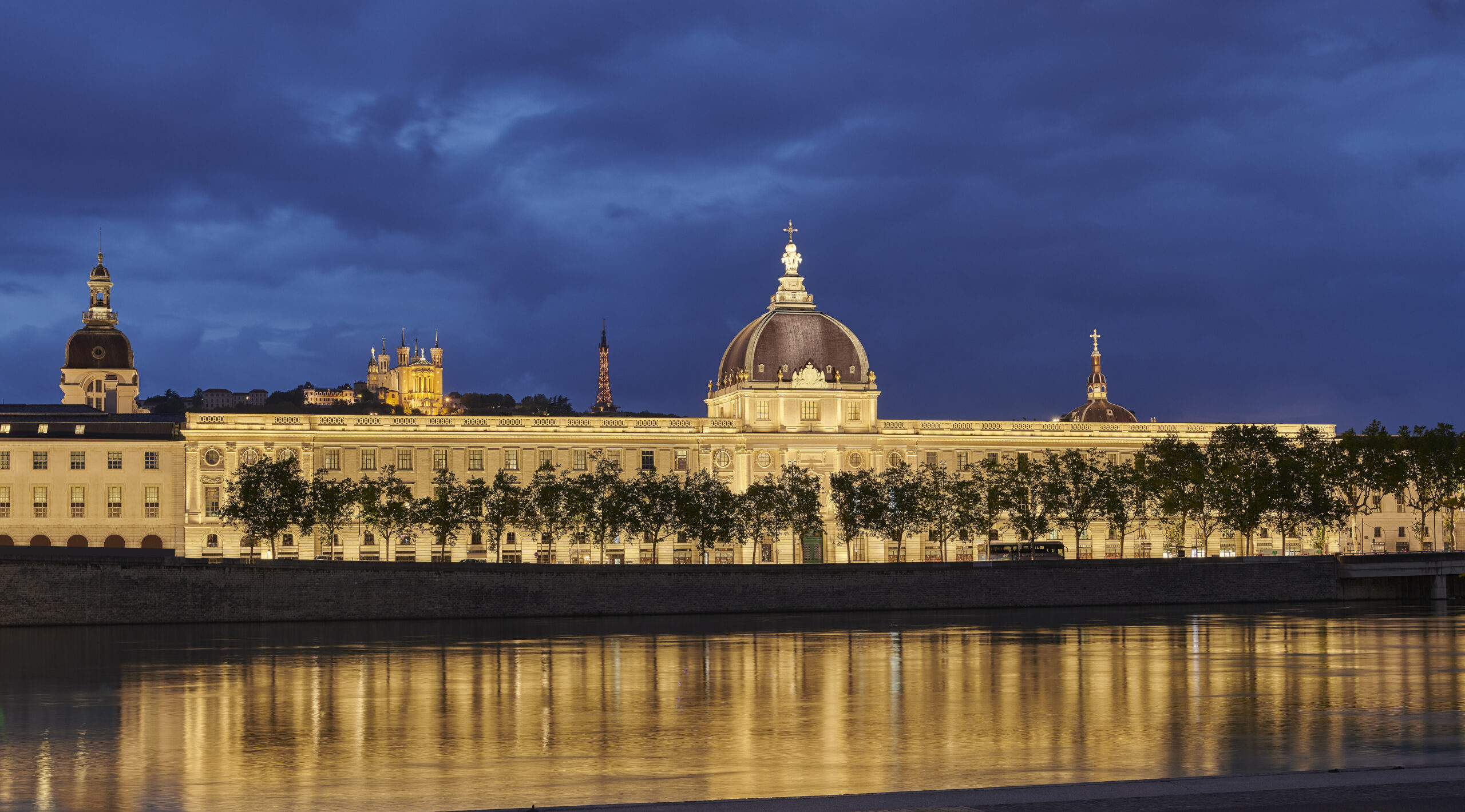 Night view of the exterior of the InterContinental Lyon Hôtel Dieu designed by the interior design studio Jean-Philippe Nuel