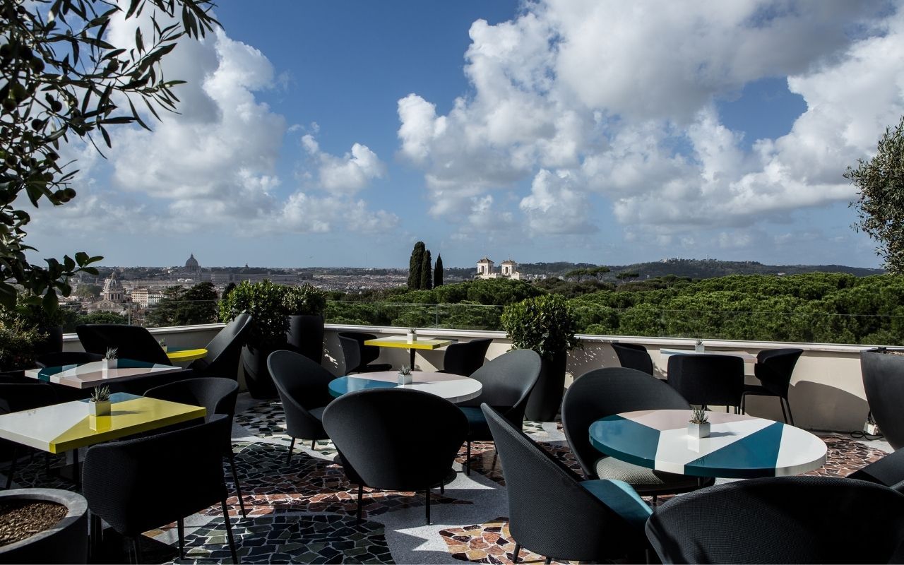 Daytime view of the Settimo rooftop of the Sofitel Rome Villa Borghese hotel designed by the interior design studio Jean-Philippe Nuel