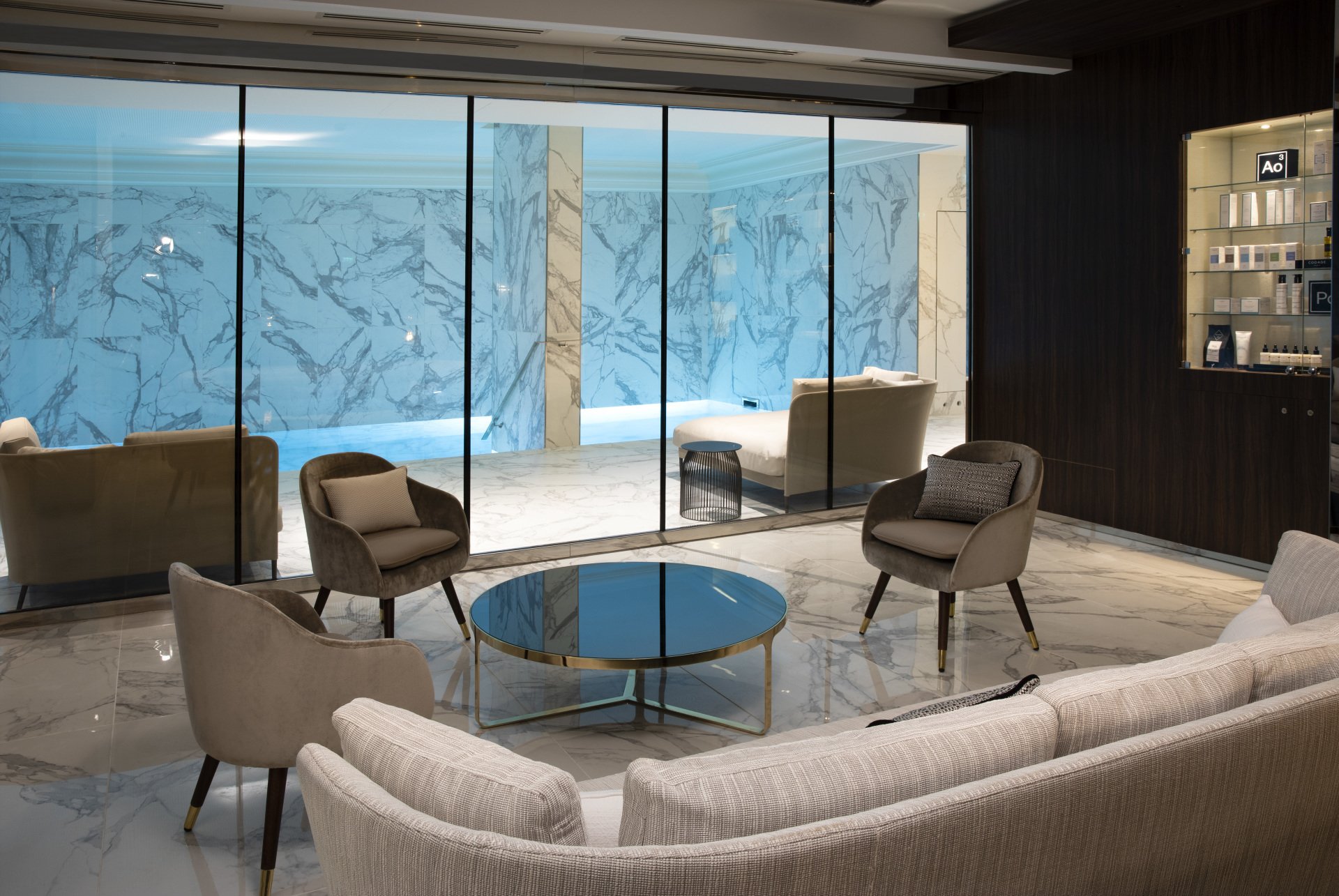 Hotel and Spa Le Damantin Paris designed by the interior design studio jean-philippe nuel - spa lounge, sofa, warm, welcoming, well-being, window, marble