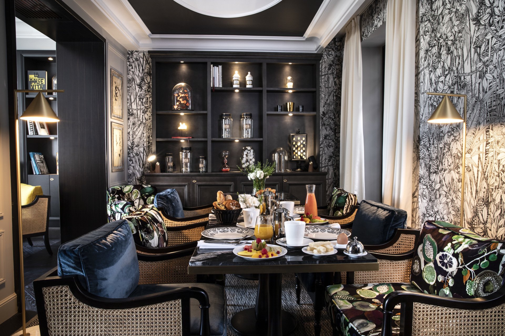 Main room of the restaurant Hotel Le Damantin in Paris designed by the French interior design studio jean-philippe nuel, with singular black and yellow decoration, flowery atmosphere like a winter garden