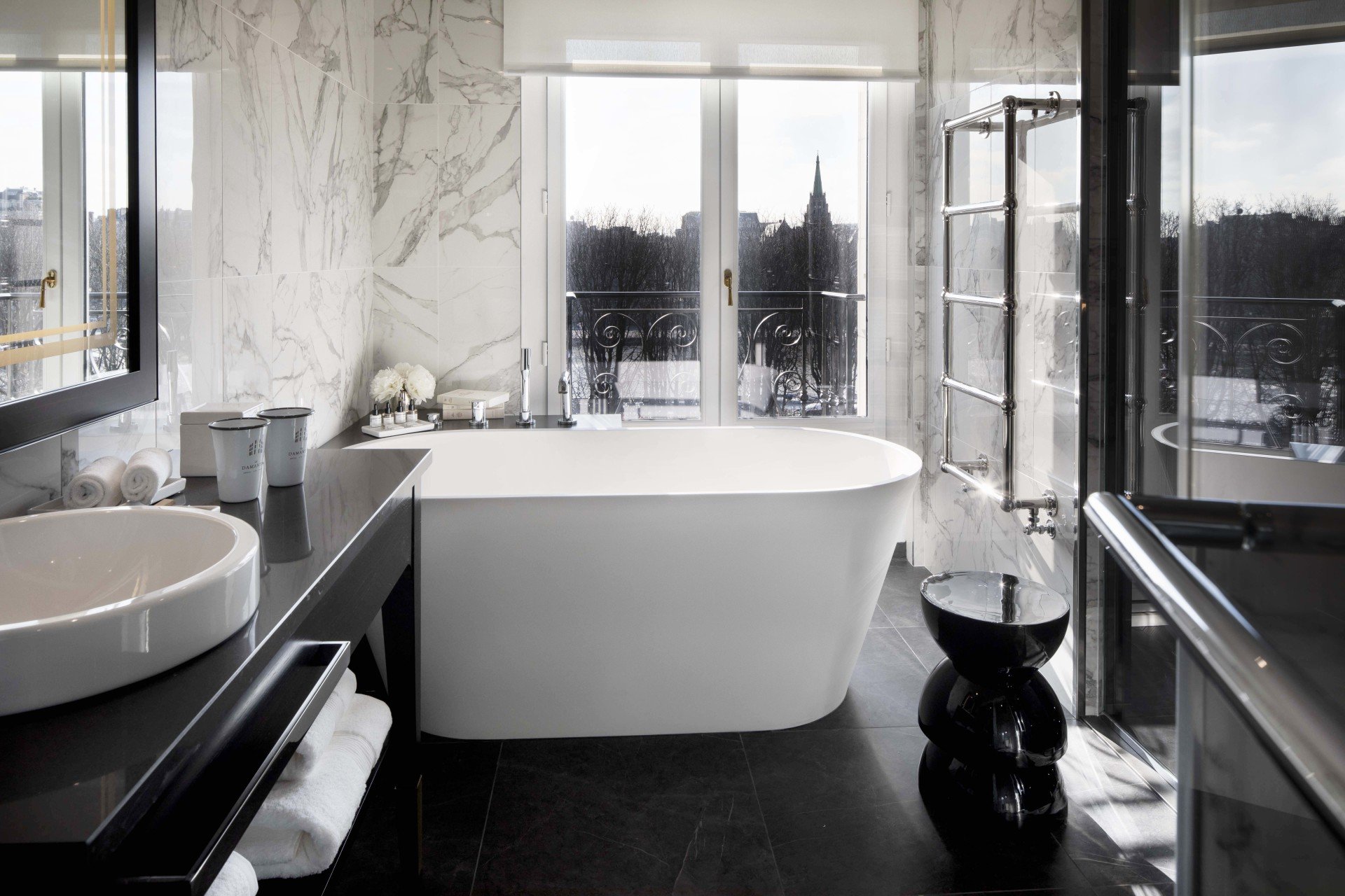 Hotel and Spa Le Damantin Paris - luxury hotel designed by the interior design studio jean-philippe nuel - luxurious bathroom, marble, bathtub and shower, view on Paris