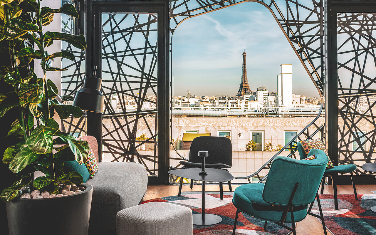 view on the eiffel tower from the rooftop of the 4 star hotel novotel paris vaugirard designed by the studio jean-philippe nuel
